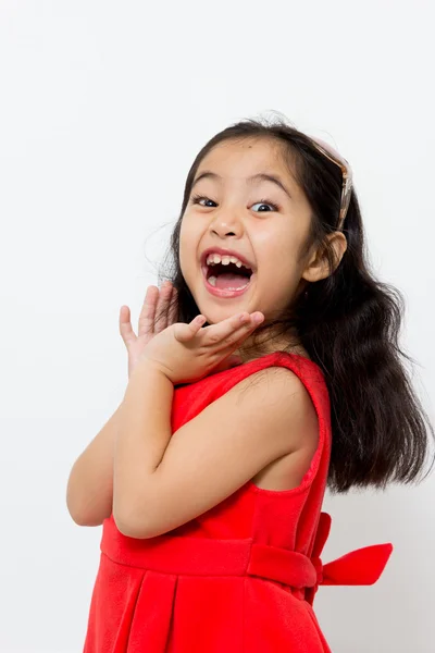 Little Asian child is smiling with red dress — Stock Photo, Image