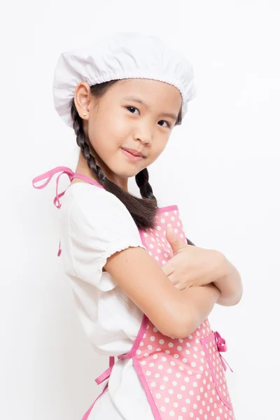 Little Asian cute chef wearing pink apron — Stock Photo, Image