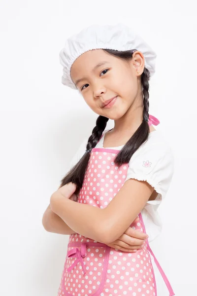 Little Asian cute chef wearing pink apron — Stock Photo, Image