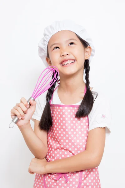 Little Asian cute chef wearing pink apron thinking action — Stock Photo, Image