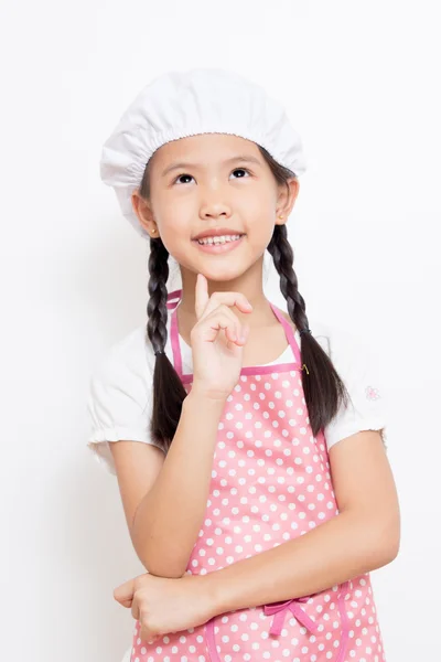 Маленький азиатский милый шеф-повар в розовом фартуке — стоковое фото