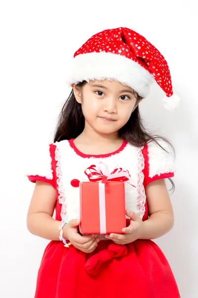 Little Asian girl holding red gif box on christmas isolated in white — Stock Photo, Image