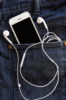 kot üzerinde akıllı telefon yakın çekim