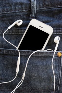 kot üzerinde akıllı telefon yakın çekim