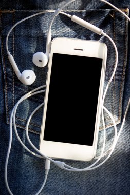 kot üzerinde akıllı telefon yakın çekim