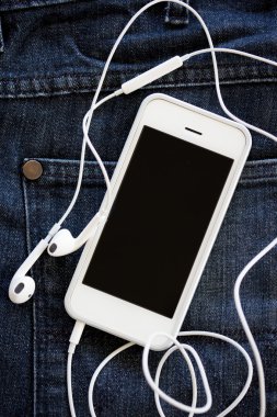 kot üzerinde akıllı telefon yakın çekim