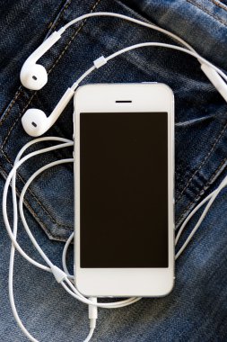 kot üzerinde akıllı telefon yakın çekim