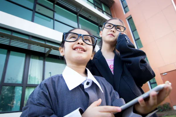 Cute little Asian child pretending to be a business worker — Stock Photo, Image