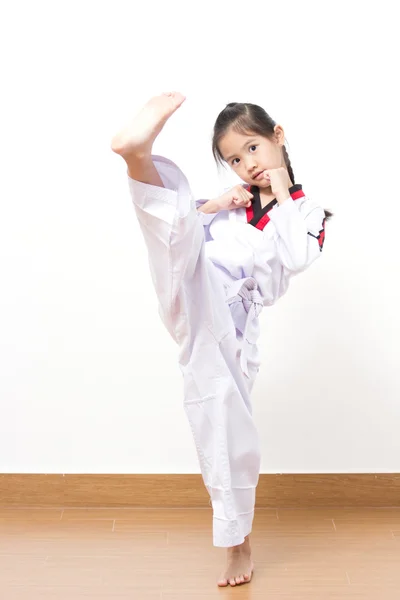 Little asian child in fighting action on isolated background — Stock Photo, Image