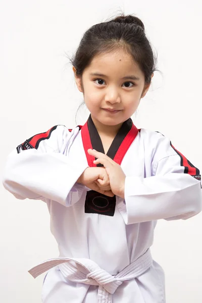 Little asian child in fighting action on isolated background — Stock Photo, Image