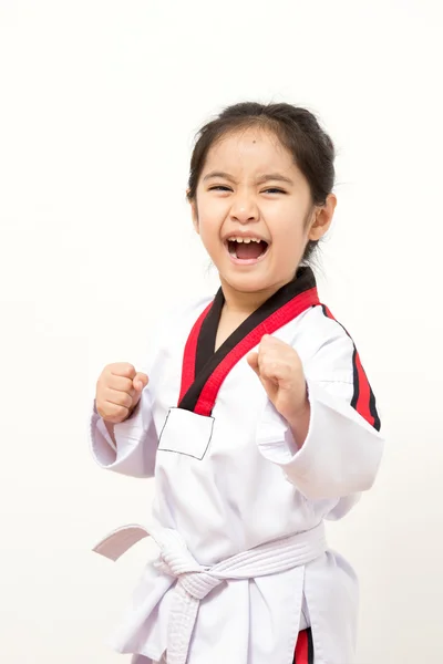 Little asian child in fighting action on isolated background — Stock Photo, Image