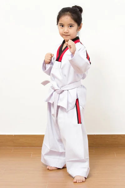 Little asian child in fighting action on isolated background — Stock Photo, Image