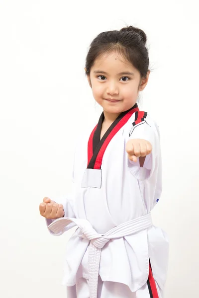 Little asian child in fighting action on isolated background — Stock Photo, Image