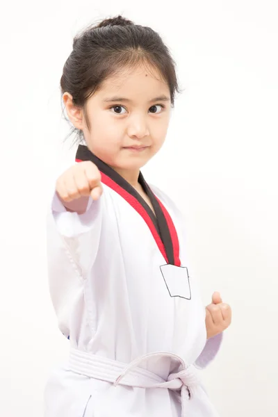 Little asian child in fighting action on isolated background — Stock Photo, Image