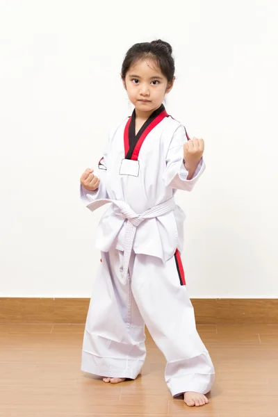 Little asian child in fighting action on isolated background — Stock Photo, Image