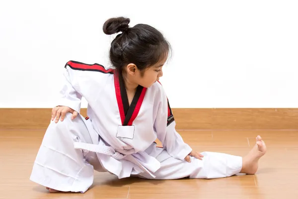 Little asian child in fighting action on isolated background — Stock Photo, Image