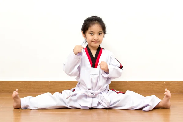 Little asian child in fighting action on isolated background — Stock Photo, Image