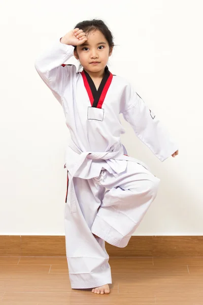 Little asian child in fighting action on isolated background — Stock Photo, Image