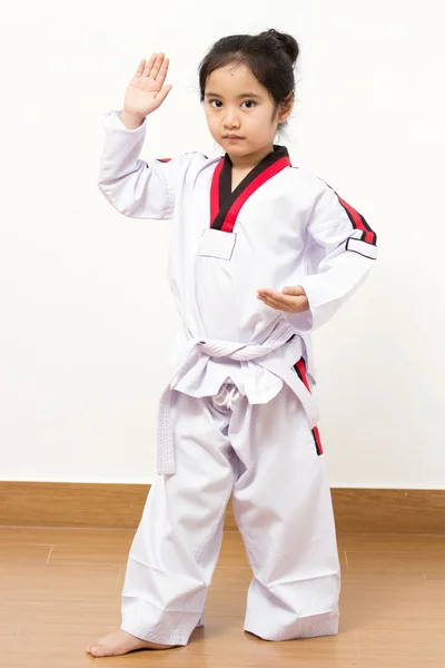 Little asian child in fighting action on isolated background — Stock Photo, Image