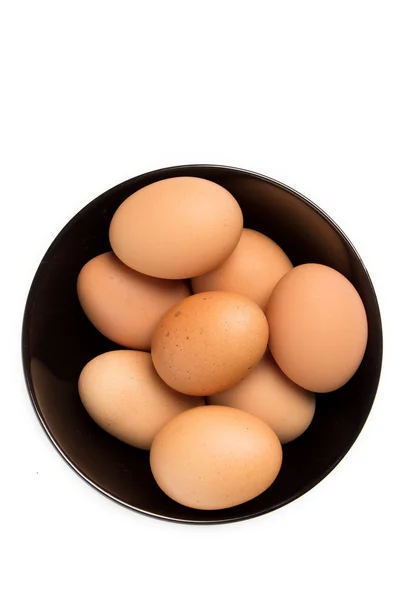 Eggs in the black bowl — Stock Photo, Image