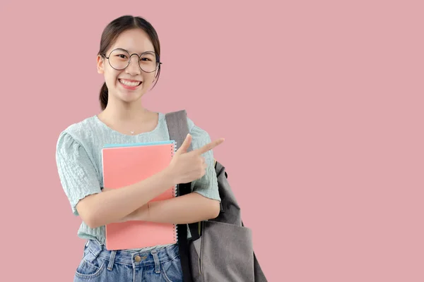 Young Asian Student Girl Isolated Pink Background Pointing Finger Side — Stock Photo, Image