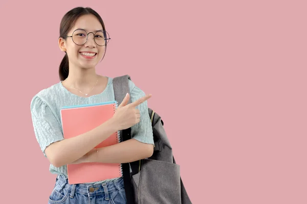 Young Asian Student Girl Isolated Pink Background Pointing Finger Side — Stockfoto