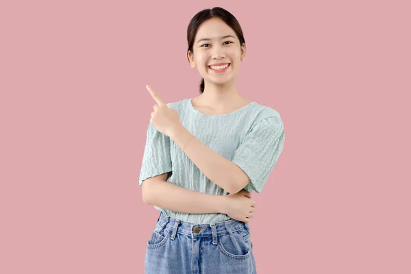 Young Asian Lovely Girl Isolated Pink Background Pointing Finger Side — Stock Photo, Image