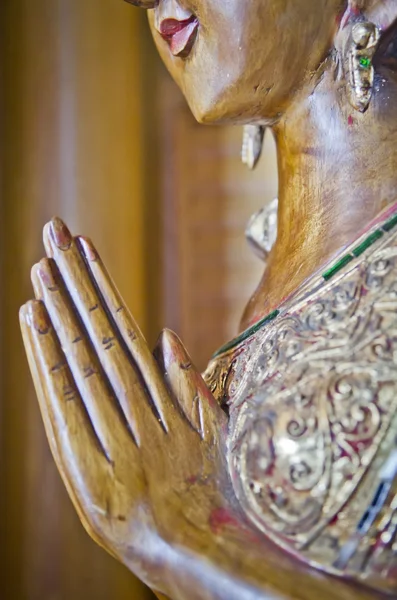 Wood handmade.Sculptures in the temple. Thai style acting Wai ( — Stockfoto