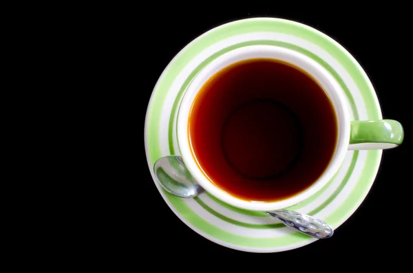 Šálek čaje a lžíce — Stock fotografie
