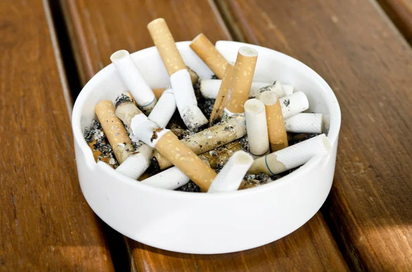 Cigarette in bin Stock Photo