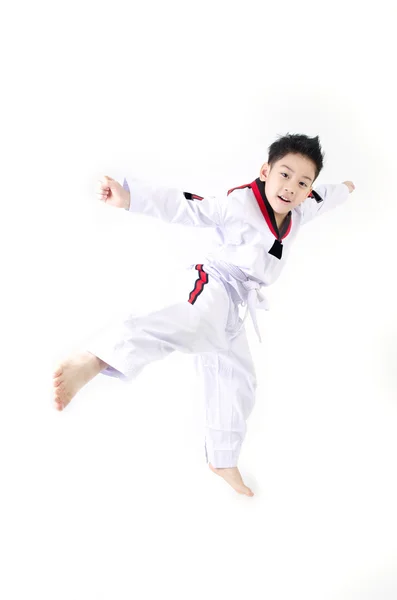 Taekwondo actie door een Aziatische schattige jongen — Stockfoto