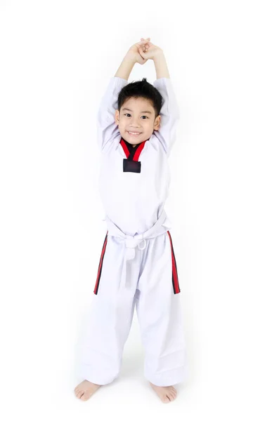 Taekwondo actie door een Aziatische glimlach jongen — Stockfoto