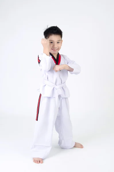 Taekwondo acción por un asiático lindo chico — Foto de Stock