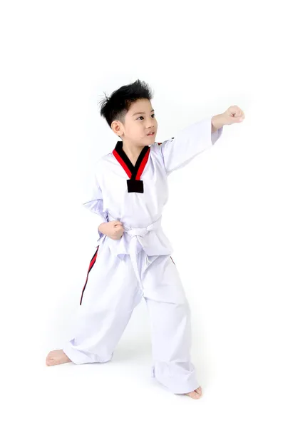 Taekwondo acción por un asiático lindo chico — Foto de Stock