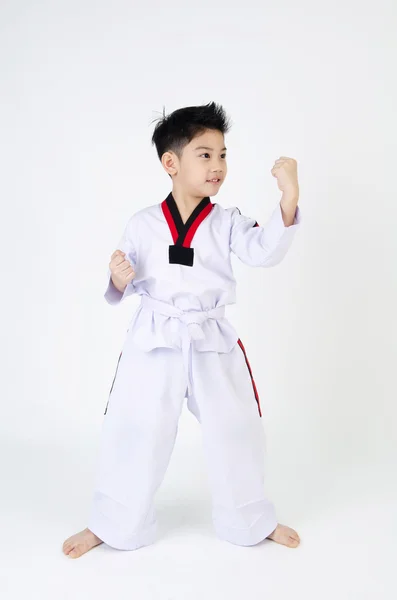 Taekwondo acción por un asiático lindo chico — Foto de Stock