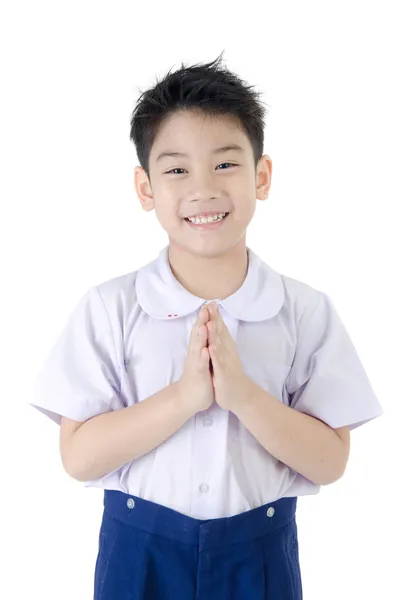 Asijské dítě chlapec v jednotné herectví sawaddee studenta na izolované — Stock fotografie