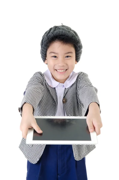 Little asian boy in student's uniform with tablet computer on is — Stock Photo, Image