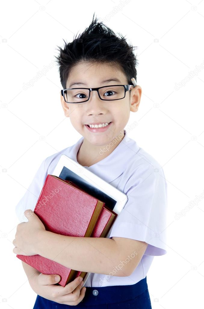 Little asian boy in student's uniform with tablet computer on is