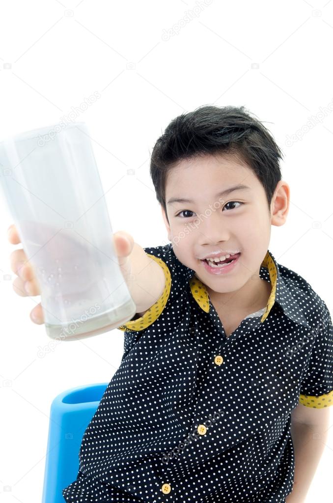 Portrait of Little asian boy drinking a glass of milk