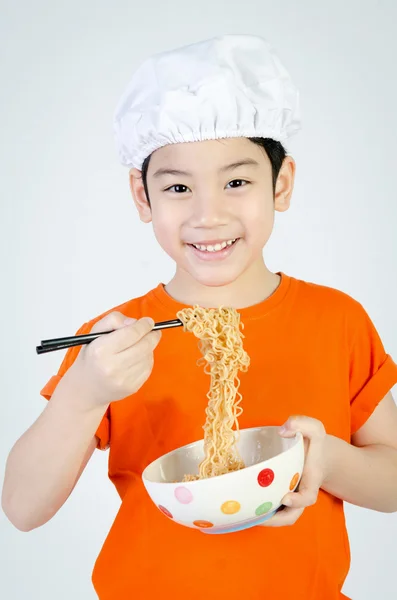 Asian cute child eating ramen noodles in ceramic bowl . — Stock Photo, Image