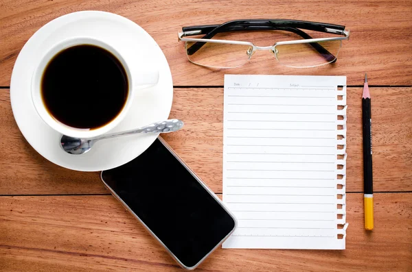 Empty notebook and a cup of coffee — Stock Photo, Image