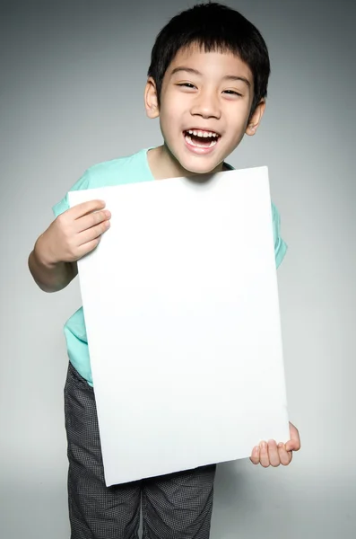 Portrait of Asian child with blank plate for add your text . — Stock Photo, Image
