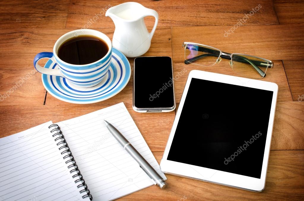  tablet pc and a coffee and Mobile phone