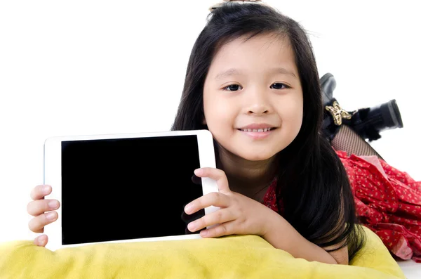 Little asian girl smiles with tablet computer — Stock Photo, Image