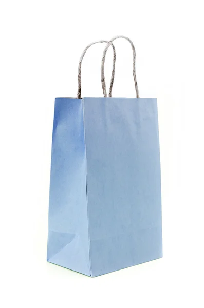 Bolso de papel azul sobre fondo blanco — Foto de Stock