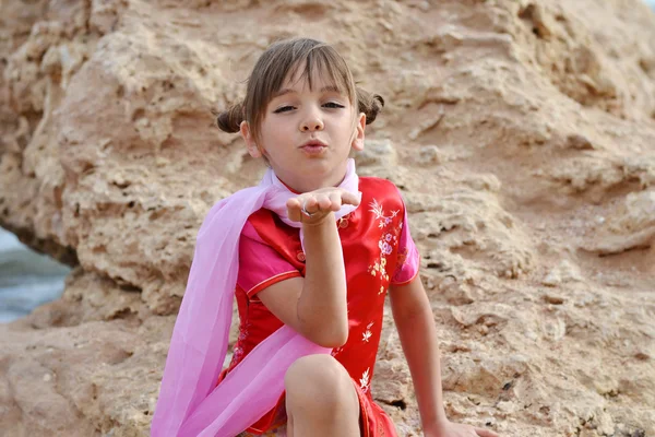 Little girl sends an air kiss — Stock Photo, Image