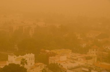 City of Las Palmas de Gran Canaria under a dense haze formed by airborne dust. Gran Canaria. Canary Islands. Spain.