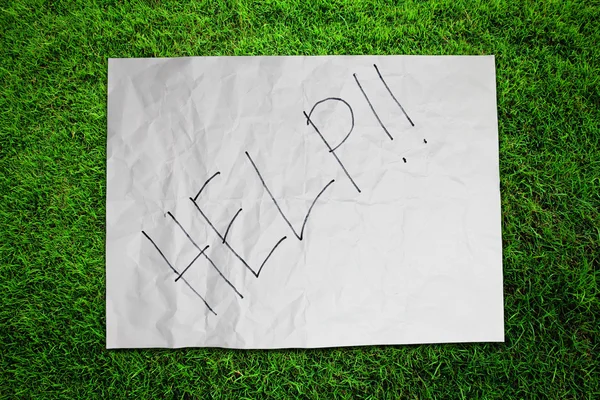 Paper Help on green grass field