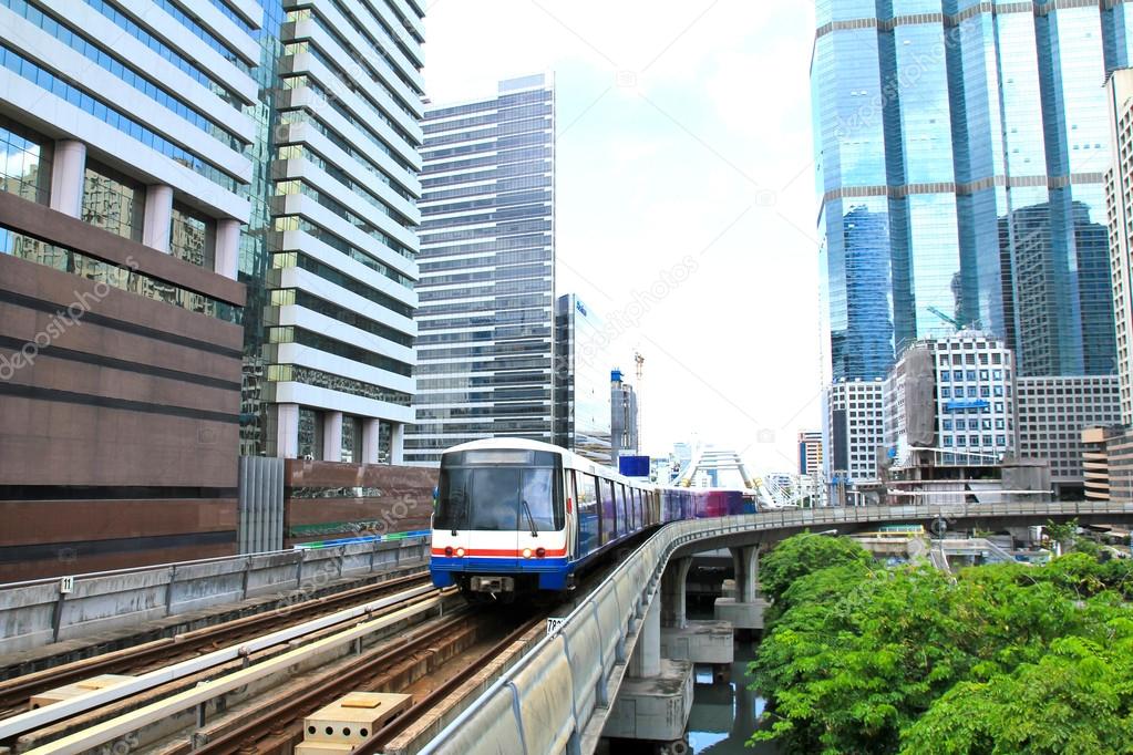 Sky train in Bangkok with business building