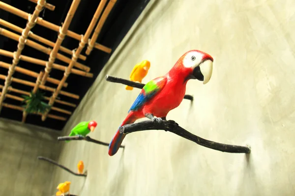 Bird sculpture colorful on wall — Stock Photo, Image